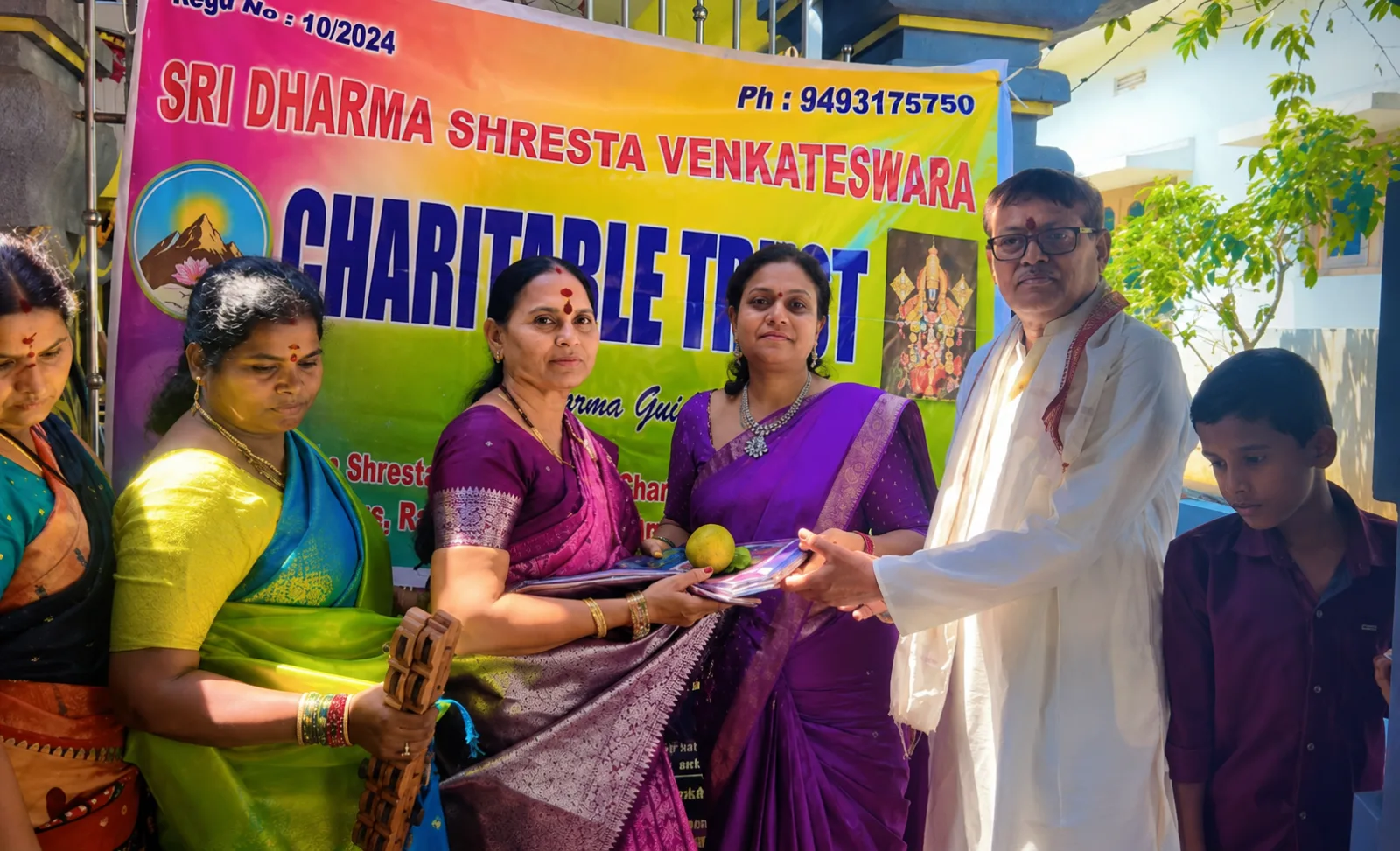 Volunteers of Sri Dharma Shresta Venkateswara Charitable Trust distributing sarees to devotees during Rama Navami
